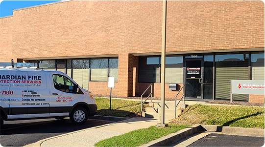 Outside view of the Guardian Fire Systems office and company van