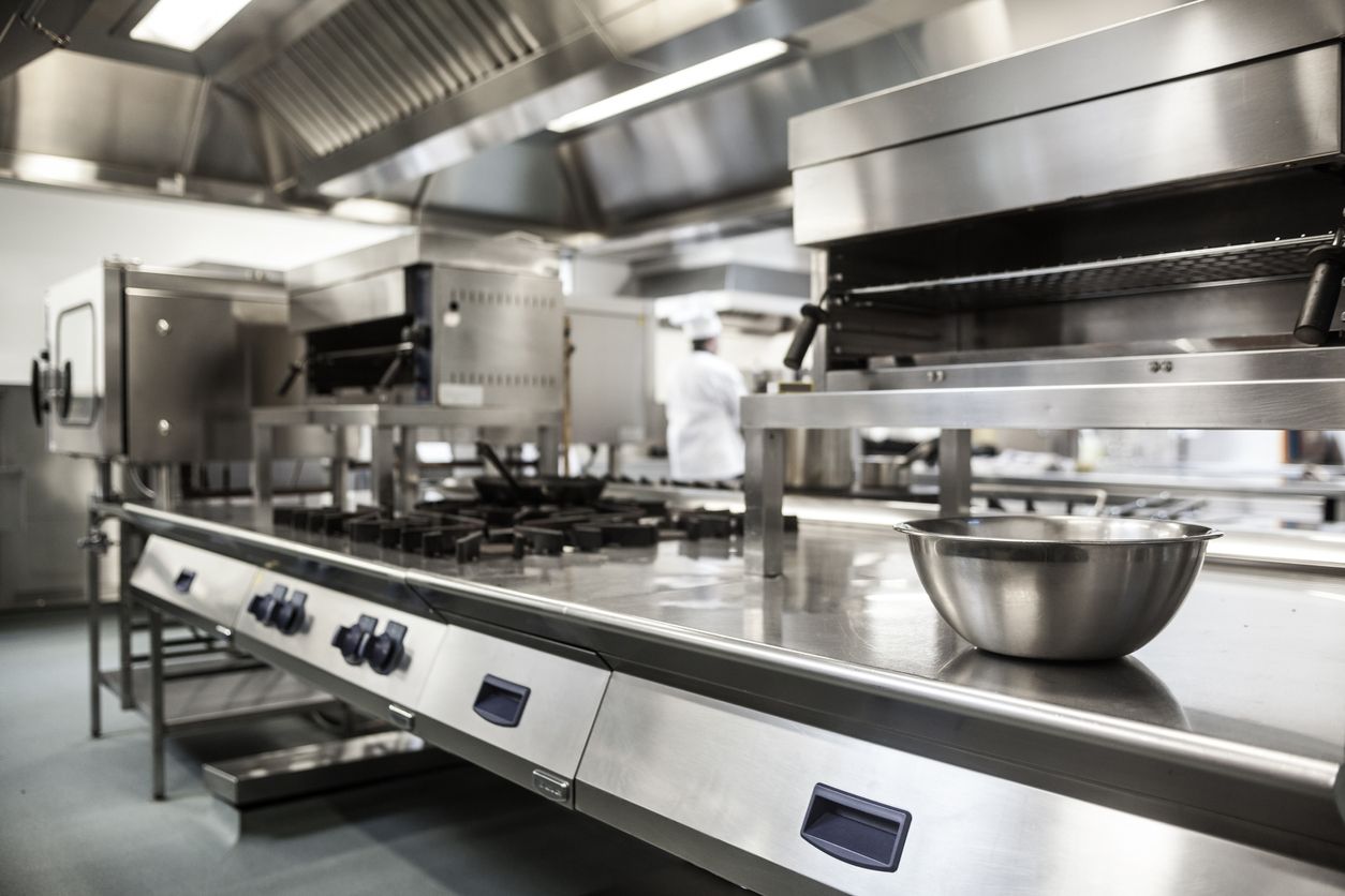 commercial kitchen - clean stainless steel appliances 